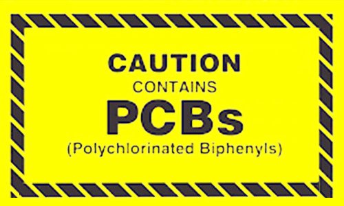 yellow sign with the words "Caution contains PCBs (Polychlorinated Biphenyls)."